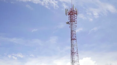 A telecommunication tower in the background a blue sky Video stock 310411679