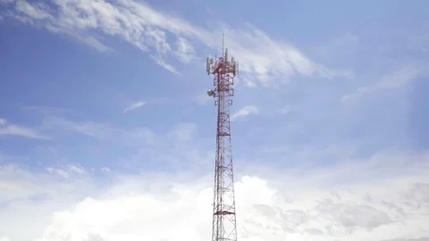 A telecommunication tower in the background a blue sky Video stock 310411735