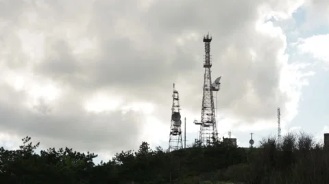 Telecommunication tower on the background of clouds Stock Footage 50373743