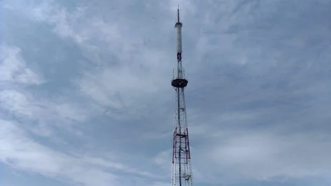 Telecommunication tower blue clouds on blue sky background Stock Footage 116720974