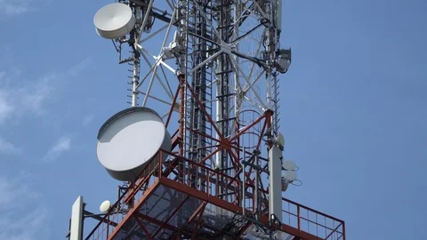 Telecommunication tower on blue sky. High broadcast antenna - internet,telephone Stock Footage 113083065
