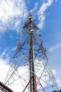 Telecommunication tower on blue sky Stock Photos