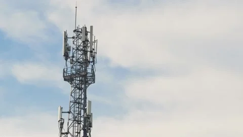 Telecommunication tower with clouds blue sky. timelapse Stock Footage 140451675