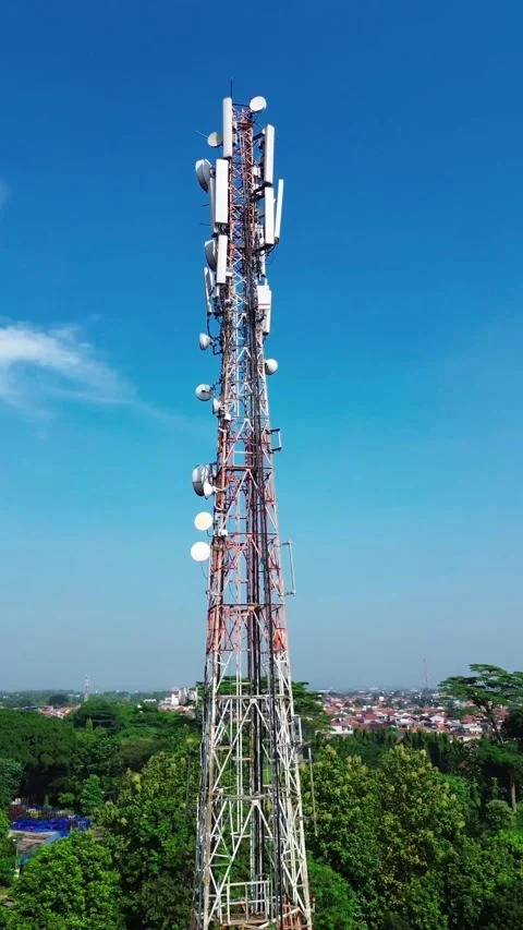 Telecommunication Tower Drone Vertical View with Blue Sky in 4K UHD Stock Footage 315094856