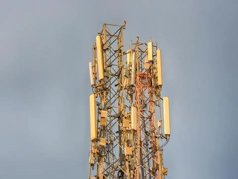 Telecommunication tower equipped with multiple cellular antennas Stockfoto's