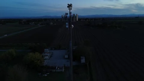Telecommunication tower featuring 5G technology antennas providing wireless Stock Footage 324707495