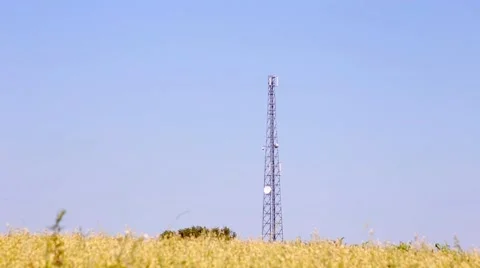 Telecommunication tower on the field Stock Footage 66437958