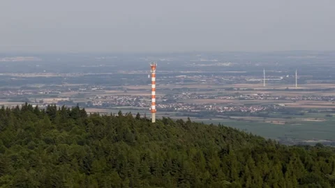 Telecommunication Tower on Forested Hill Overlooking Expansive Valley Landscape Stock Footage 339356764