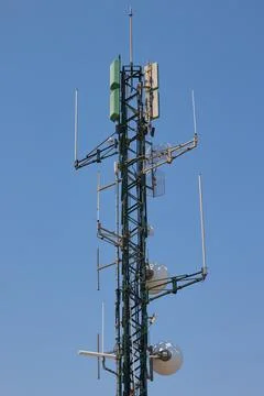 Telecommunication tower with multiple communication antennas Stock Photos
