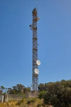 Telecommunication tower with multiple communication antennas Stock Photos
