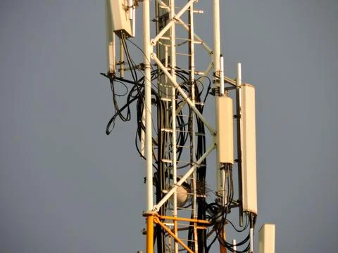 This telecommunication tower multiple white rectangular sector antennas desi Фото