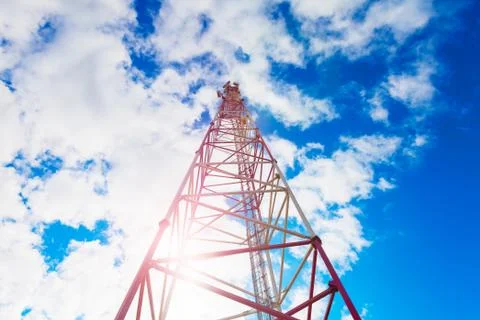 Telecommunication tower with panel antennas and radio antennas and satellite Stock Photos