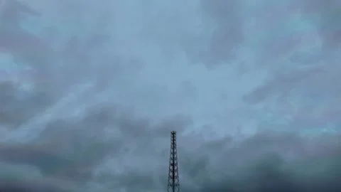 A telecommunication tower standing tall against a dramatic sky Video stock 346627425