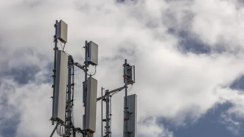 Telecommunication tower timelapse with white clouds and blue sky on a background Stock Footage 274351442
