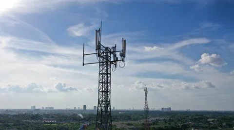 Telecommunication tower in town Stock Photos