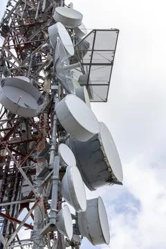 Telecommunication tower transmitting wireless network signals Stock Photos