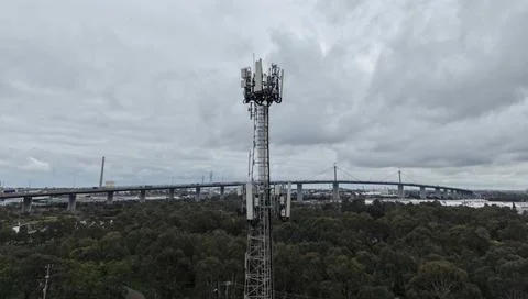 Telecommunications cell tower with West Gate Bridge in Melbourne Stock Photos