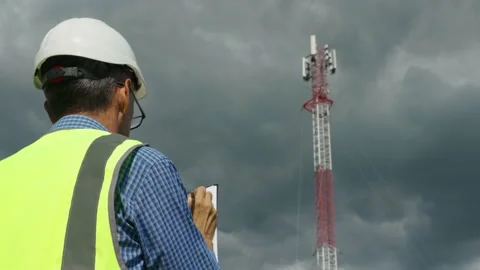 Telecommunications engineer checking the signal from a telecommunications tower Stock Footage 167356765