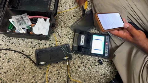Telecommunications Engineer Splicing Fiber Optic Cable Using Fusion Splicer.. Stock Footage 339480645