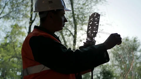 Telecommunications engineer working with optical coupling Stock Footage 89230142