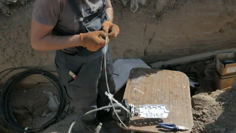 Telecommunications engineer working with optical coupling Stock Footage 94756541