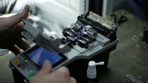 Telecommunications engineer working with optical coupling Stock Footage 126949281