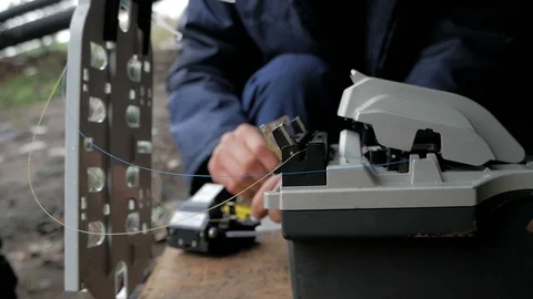 Telecommunications engineer working with optical coupling Stock Footage 126949754