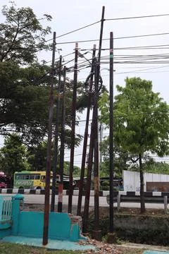 Telecommunications poles stand in disarray Stock Photos