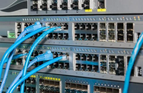 Telecommunications rack with switches and patch cords Stock Photos