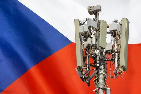 Telecommunications tower with a 5G cellular network antenna agains flag of Cz Stock Photos
