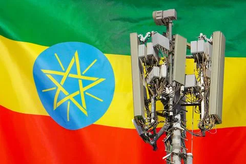 Telecommunications tower with a 5G cellular network antenna agains flag of Et Stock Photos