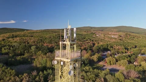 Telecommunications tower above forested Mátra hills in Sástó, Hungary Stock Footage 346664057
