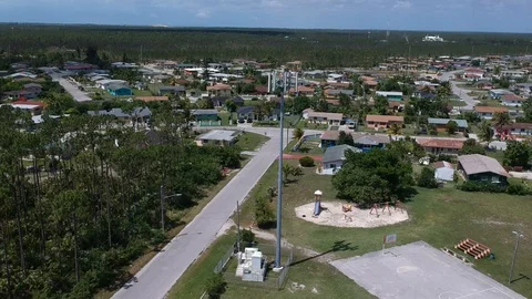 Telecommunications Tower Amid Pioneers Loop Neighborhood Homes, Freeport Aerial Stock Footage 90105536