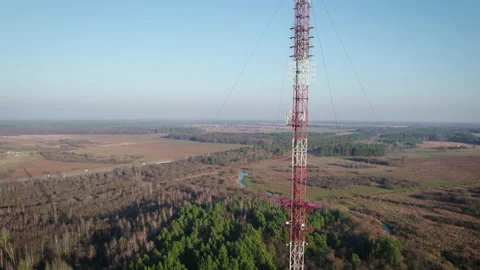 Telecommunications tower on the background of the blue sky in the countryside. Stock Footage 168071374