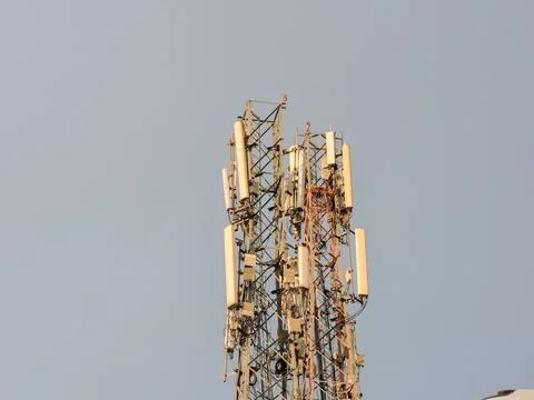 Telecommunications tower,  as a cell tower, which houses multiple antennas Stock Photos
