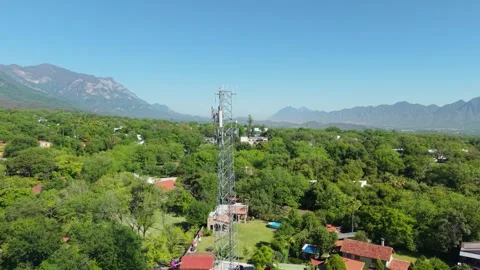 Telecommunications Tower with Mountain Backdrop Stockbeeldmateriaal 308669941