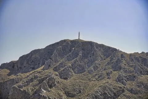 Telecomunication tower at the top of a hill Stock Photos