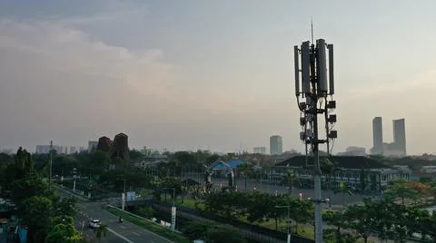 Telecomunication tower in town Stock Photos