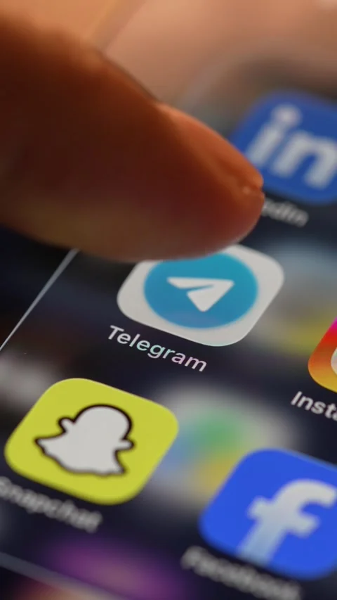 Telegram App Opening on Smartphone Screen 動画素材 343415577