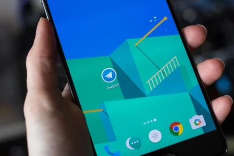 Telegram application on smartphone display Stock Photos