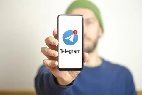 Telegram messenger app. Smartphone with Telegram messenger application on scr Stock Photos