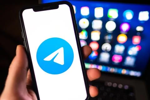 Telegram messenger logo on smartphone screen. Stock Photos