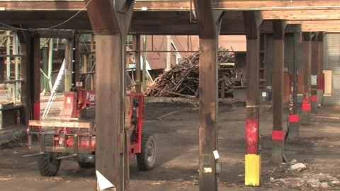Telehandler Rolling past Wood Beams at Deconstruction Site in Bonner Stock Footage 134201503