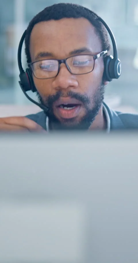 Telemarketing, computer and man with headset in office, help and discussion with Stock Footage 343386349