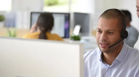 Teleoperator in office with manager Stock Footage