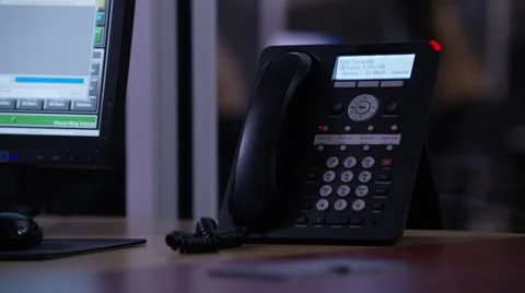 Telephone and a computer kept on the office table Vídeo Stock 67553707