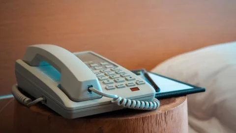 A telephone and notebook with bed, Stock Photos