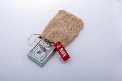 Telephone booth  and bundle of dollar Stock Photos