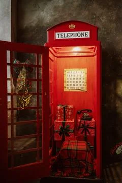 Telephone booth, red in the interior Stock Photos