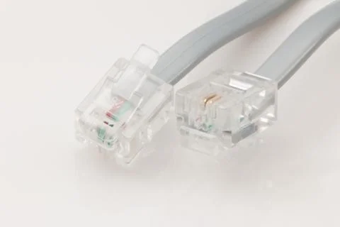 Telephone cable with connector ends. Stock Photos